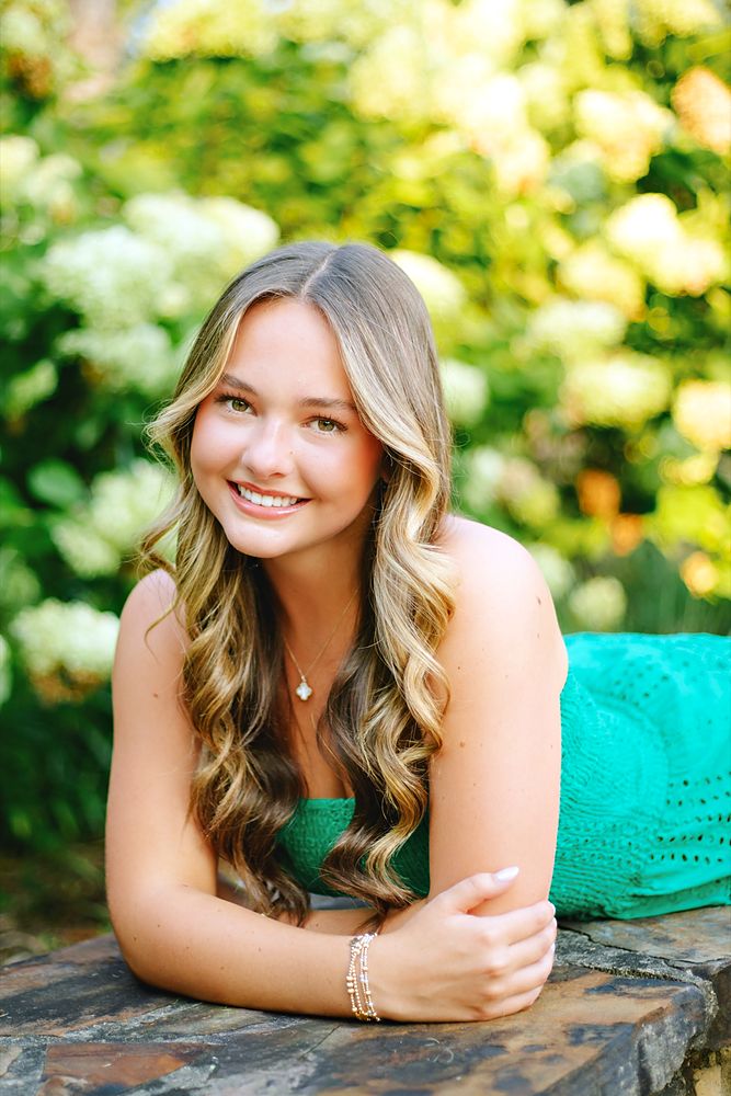Smiling portrait by the hydrangeas